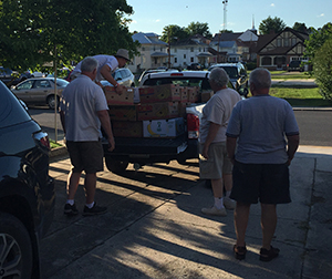 Volunteers Loading Food Donations into a truck